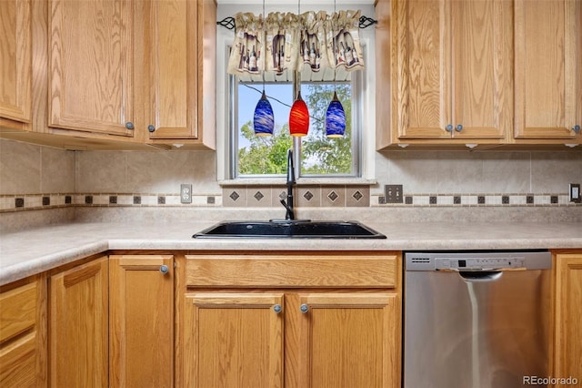 1026 Spencer St, Longmont, CO 80501 - kitchen featuring dishwasher, light countertops, and backsplash