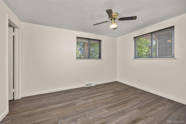 1026 Spencer St, Longmont, CO 80501 - spare room with dark wood-type flooring and ceiling fan