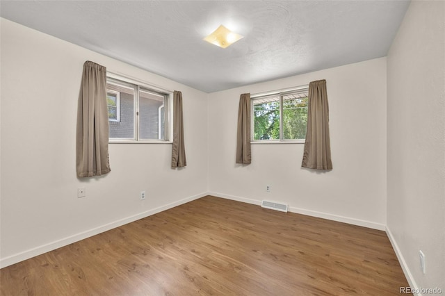 1026 Spencer St, Longmont, CO 80501 - empty room with wood finished floors and baseboards
