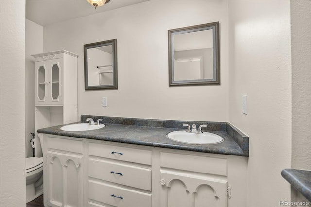 1026 Spencer St, Longmont, CO 80501 - full bathroom featuring double vanity and toilet