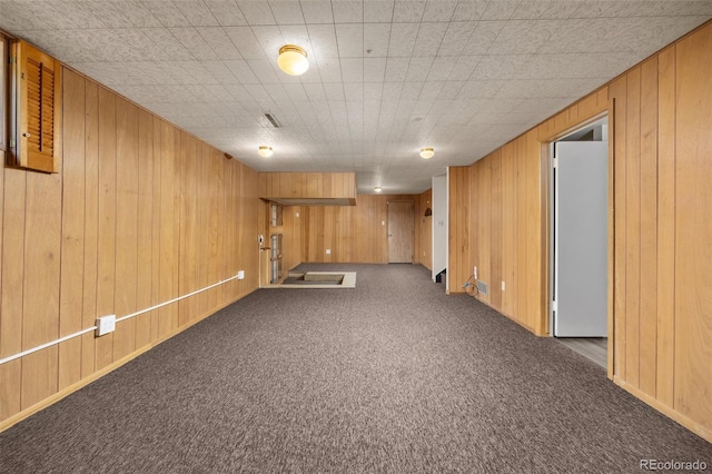 1026 Spencer St, Longmont, CO 80501 - finished below grade area featuring carpet floors and wood walls