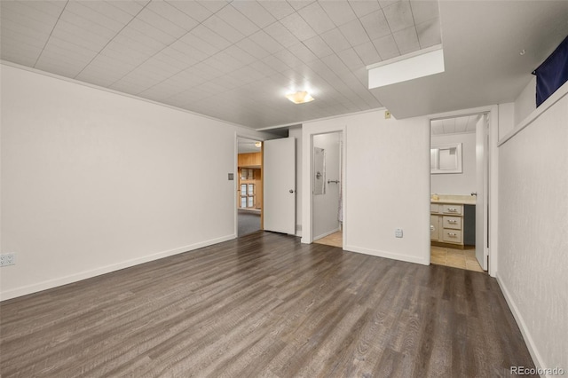 1026 Spencer St, Longmont, CO 80501 - unfurnished bedroom with ensuite bath and wood finished floors