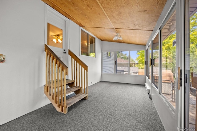 1026 Spencer St, Longmont, CO 80501 - unfurnished sunroom with vaulted ceiling and a ceiling fan