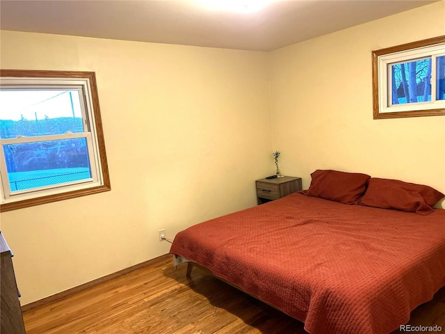 bedroom with light hardwood / wood-style flooring