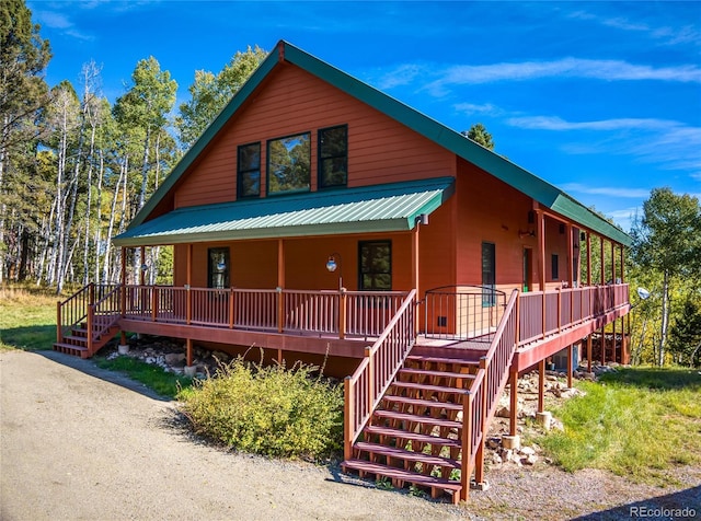 180 Ridge Rd, Cimarron, CO 81220 - chalet / cabin with stairs and covered porch
