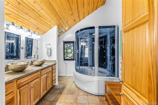 180 Ridge Rd, Cimarron, CO 81220 - full bathroom featuring vaulted ceiling, a jetted tub, double vanity, wooden ceiling, and baseboards