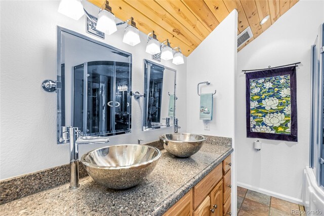 180 Ridge Rd, Cimarron, CO 81220 - bathroom with wood ceiling, double vanity, baseboards, and vaulted ceiling