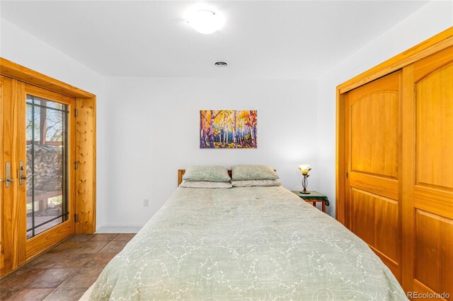180 Ridge Rd, Cimarron, CO 81220 - bedroom with a closet, access to outside, and baseboards