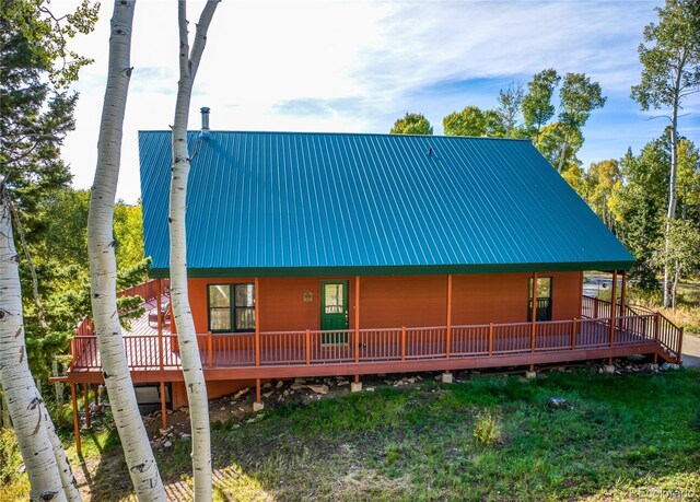 180 Ridge Rd, Cimarron, CO 81220 - view of front of house with metal roof and a front yard