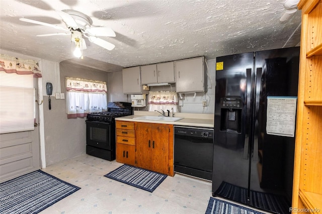379 Sisneros St, Center, CO 81125 - kitchen featuring black appliances, light countertops, a ceiling fan, light floors, and a textured ceiling