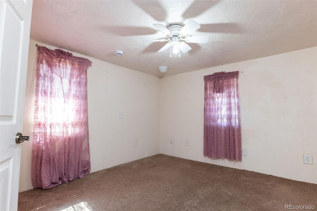 379 Sisneros St, Center, CO 81125 - spare room with carpet flooring, a ceiling fan, a smoke detector, and a textured ceiling