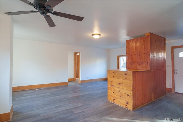 kitchen with ceiling fan and dark hardwood / wood-style flooring