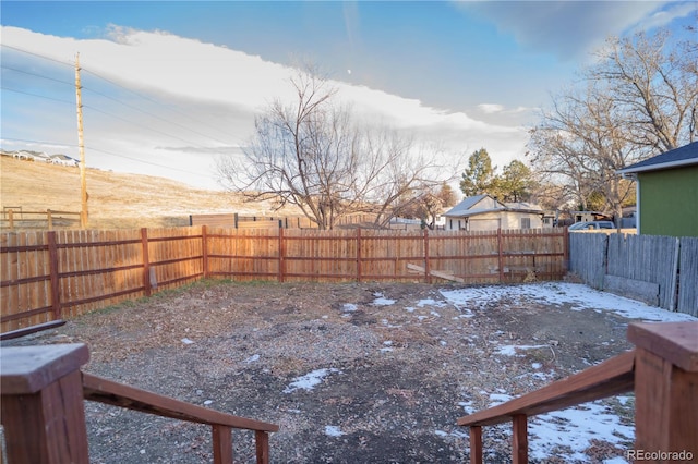 view of yard layered in snow