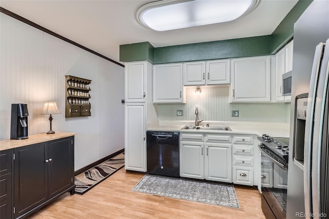 2853 S Xanadu Way, Aurora, CO 80014 - kitchen with stainless steel appliances, light countertops, light wood-style floors, and white cabinetry