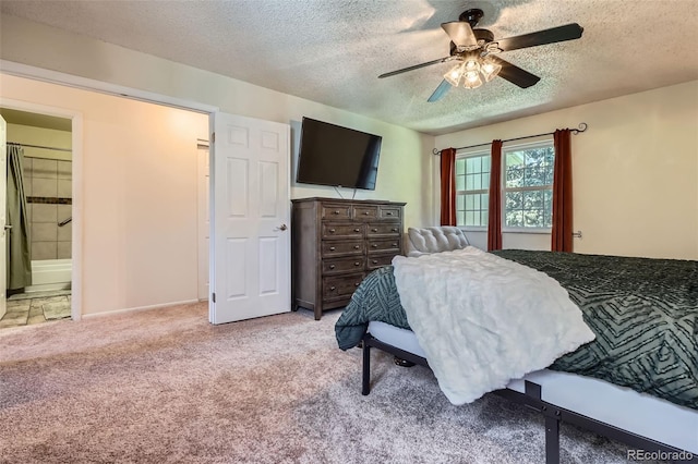 2853 S Xanadu Way, Aurora, CO 80014 - bedroom featuring light colored carpet, a textured ceiling, a ceiling fan, and connected bathroom