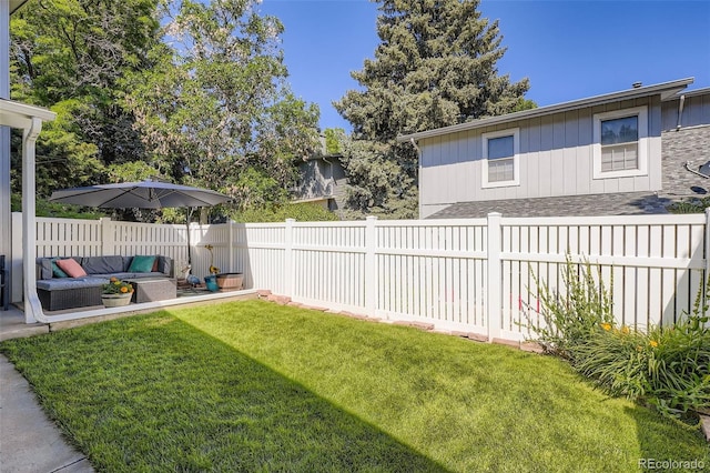 2853 S Xanadu Way, Aurora, CO 80014 - fenced backyard with an outdoor living space