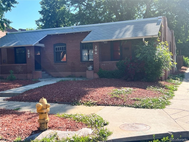 292-296 S Lafayette St, Denver, CO 80209 - ranch-style house featuring brick siding and a porch