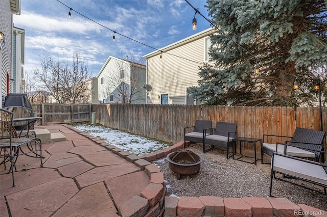 view of patio / terrace featuring a fire pit