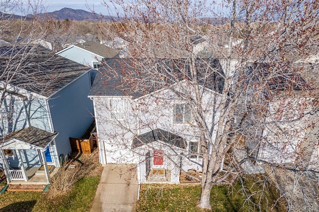 birds eye view of property with a mountain view