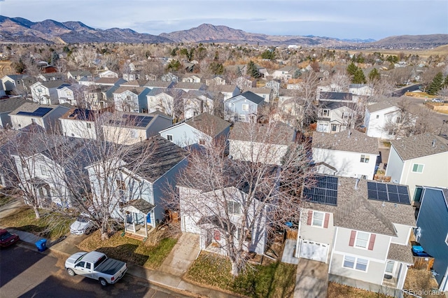 birds eye view of property with a mountain view