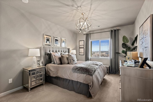 bedroom with visible vents, baseboards, light colored carpet, and a chandelier