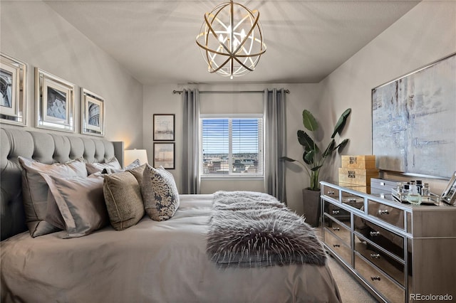 carpeted bedroom featuring a notable chandelier