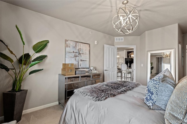 carpeted bedroom with an inviting chandelier, fridge, baseboards, and visible vents