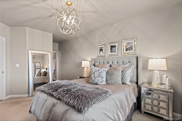 bedroom with a chandelier, light colored carpet, and baseboards