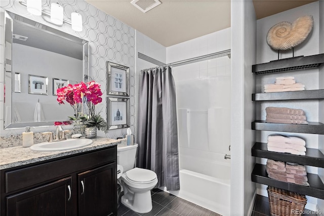 full bathroom featuring vanity, tile patterned floors, toilet, and visible vents