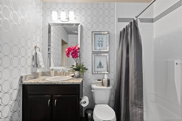 bathroom with vanity, toilet, and a shower with shower curtain