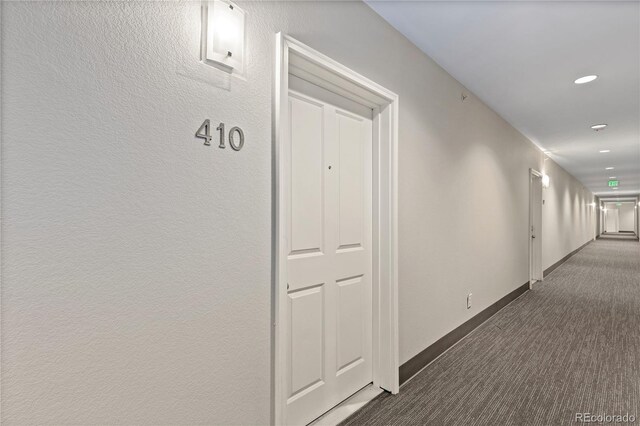 hall with recessed lighting, baseboards, and carpet