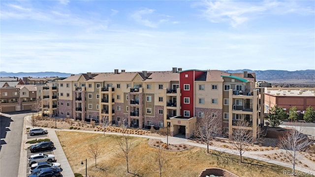 view of property with a residential view and a mountain view