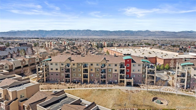 drone / aerial view featuring a residential view and a mountain view