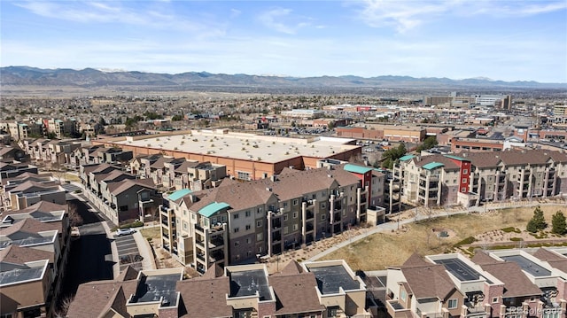 birds eye view of property with a mountain view and a residential view