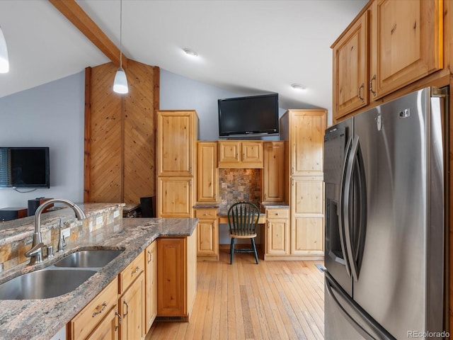 19093 W 61st Pl, Golden, CO 80403 - kitchen with lofted ceiling with beams, a sink, light wood-type flooring, stainless steel refrigerator with ice dispenser, and decorative light fixtures