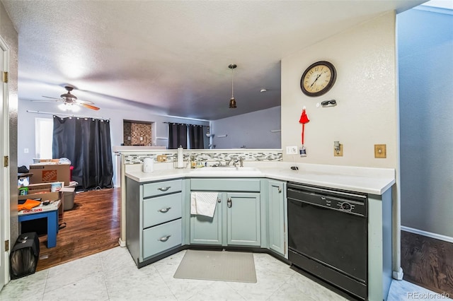 kitchen featuring decorative backsplash, kitchen peninsula, ceiling fan, sink, and dishwasher