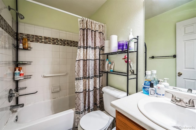 full bathroom with vanity, shower / bath combination with curtain, and toilet