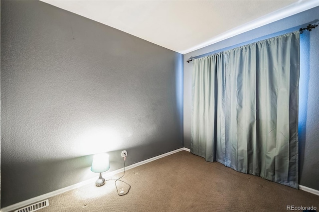 empty room featuring carpet flooring