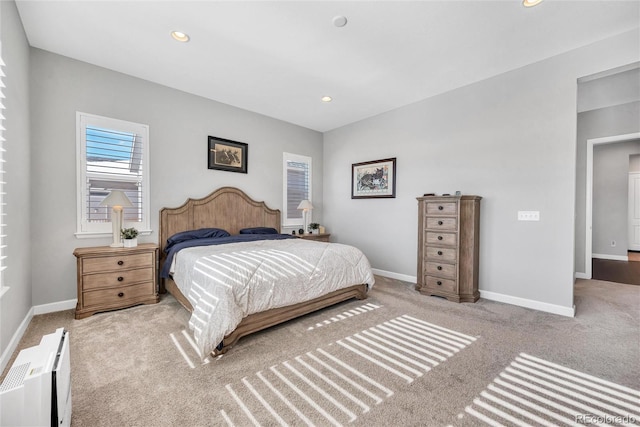 bedroom with radiator and carpet flooring