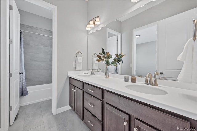 bathroom with vanity, tile patterned flooring, and shower / bath combo