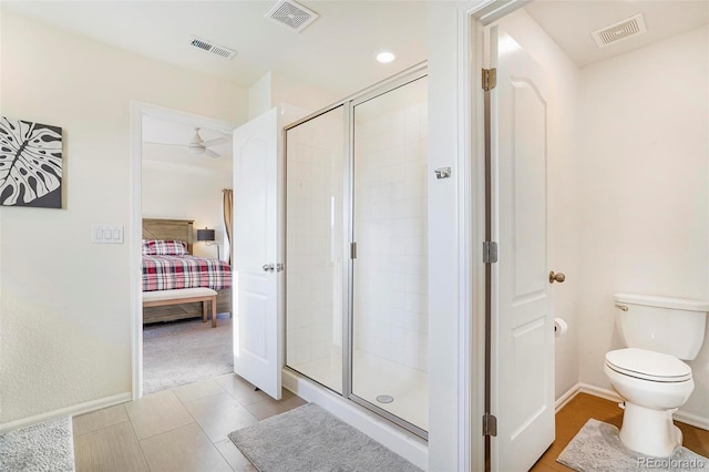 ensuite bathroom with a shower stall and visible vents