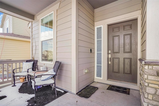 entrance to property featuring covered porch