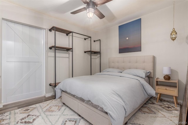 4899 S Dudley St Unit 14F, Littleton, CO 80123 - bedroom featuring wood finished floors and ceiling fan
