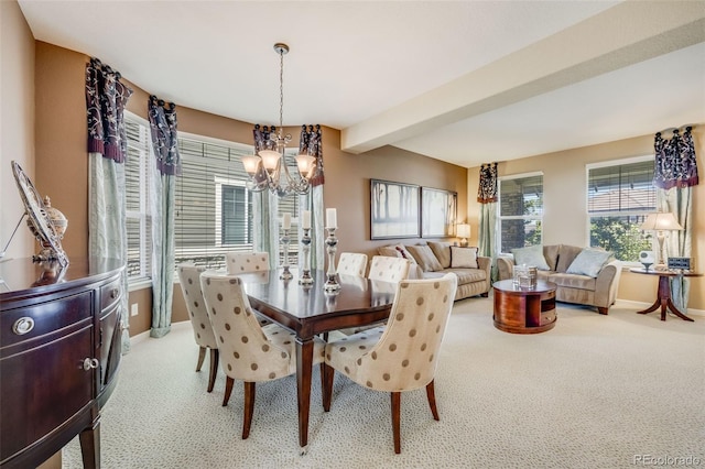 26764 E Canyon Ave, Aurora, CO 80016 - carpeted dining area with a chandelier, baseboards, and beam ceiling
