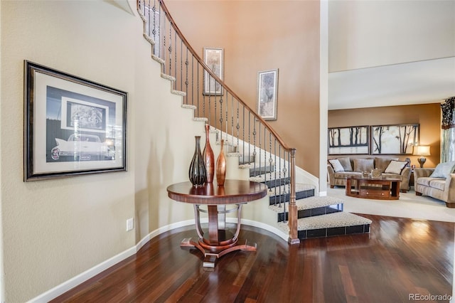 26764 E Canyon Ave, Aurora, CO 80016 - stairway with wood finished floors, baseboards, and a high ceiling