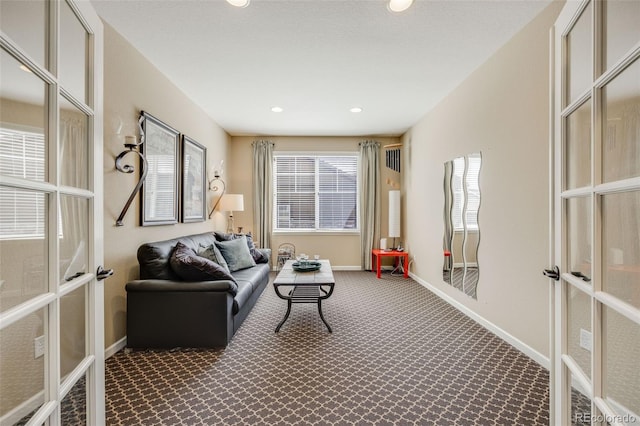 26764 E Canyon Ave, Aurora, CO 80016 - living room with french doors, carpet flooring, baseboards, and recessed lighting