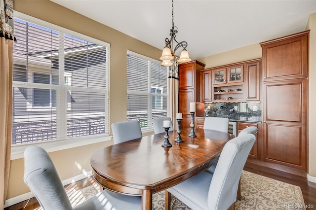 26764 E Canyon Ave, Aurora, CO 80016 - dining room with baseboards and dark wood-style floors