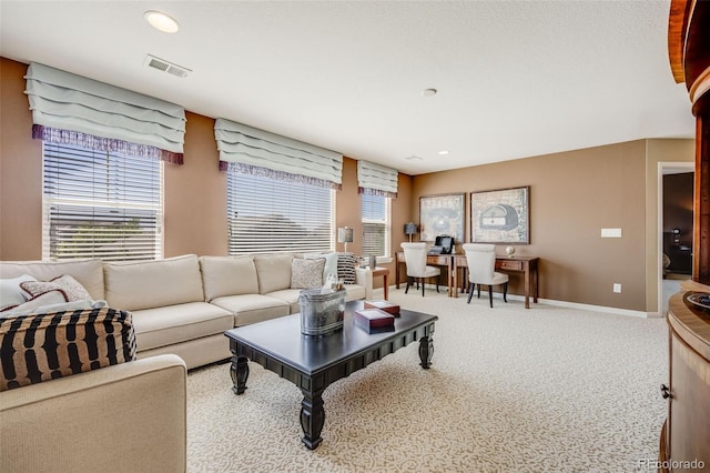 26764 E Canyon Ave, Aurora, CO 80016 - living area with healthy amount of natural light, recessed lighting, baseboards, carpet floors, and an office area