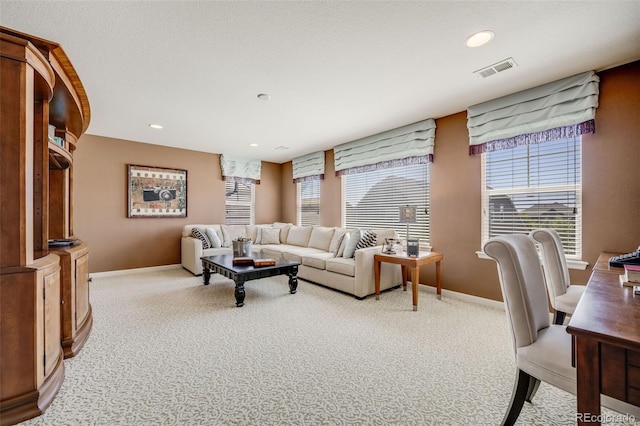 26764 E Canyon Ave, Aurora, CO 80016 - living room featuring baseboards, light colored carpet, and recessed lighting