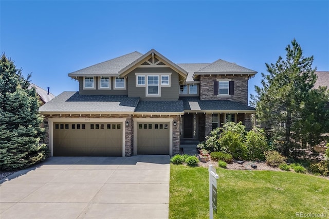 26764 E Canyon Ave, Aurora, CO 80016 - craftsman-style house with a garage, stone siding, concrete driveway, a front yard, and roof with shingles